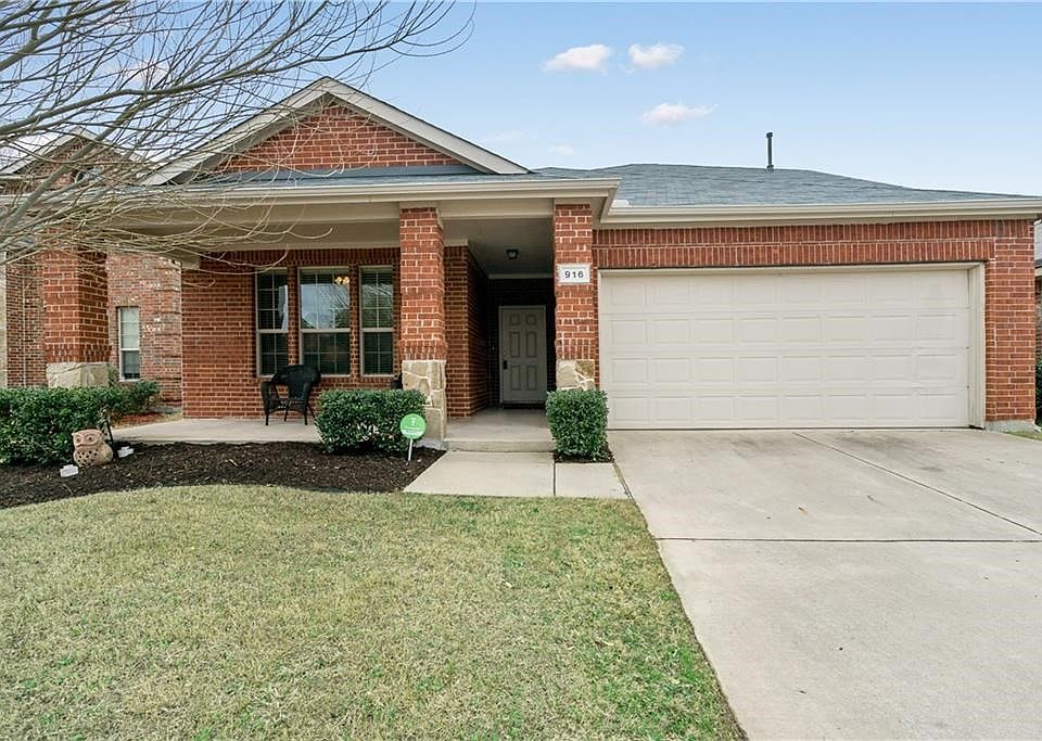 Super Cute home with awesome covered front porch and extensive bed for landscaping!