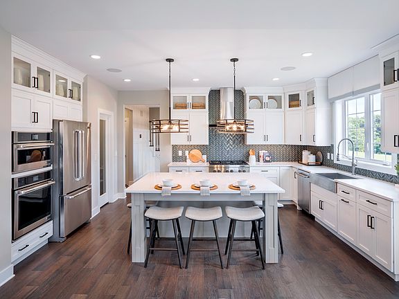 The open-concept kitchen and great room provide the ideal space for entertaining