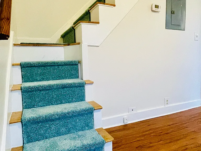 New carpet on the stairs that lead from dining room to bedrooms upstairs