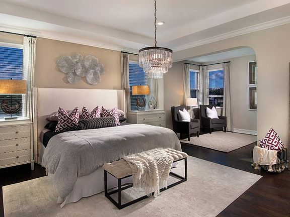 The sophisticated owner s suite prioritizes comfort and leisure with an attached sitting room for ex