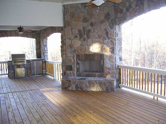 Covered rear offers grill, refrigrator and fireplace!
