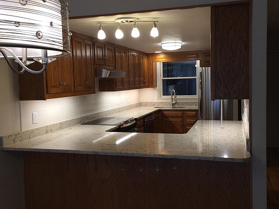 Quartz, LED under cabinet lighting, stainless appliances,