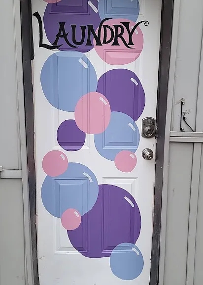 Exterior door to shared laundry room. it can also be seen in first exterior photo.