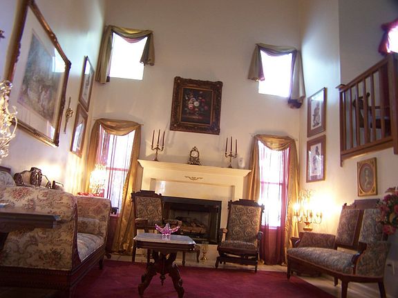 great room has 25' ceiling and marble gas fireplace