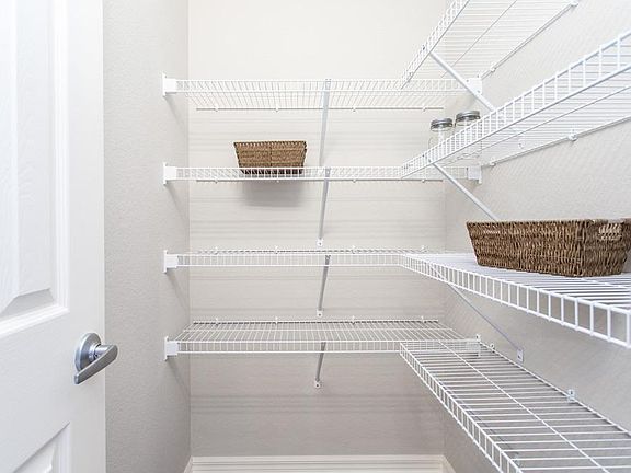 Have plenty of storage with a large walk-in pantry - New home for sale in Eagle Lake, FL. Photo show