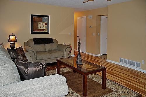 Hickory floors extend to hallway.