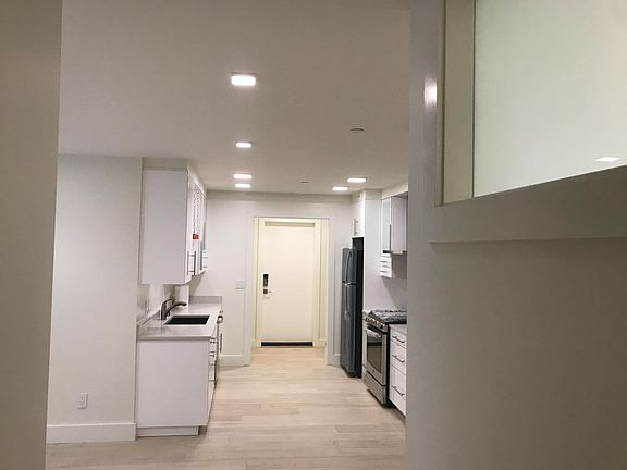 Spacious kitchen with all new appliances (view form hallway)