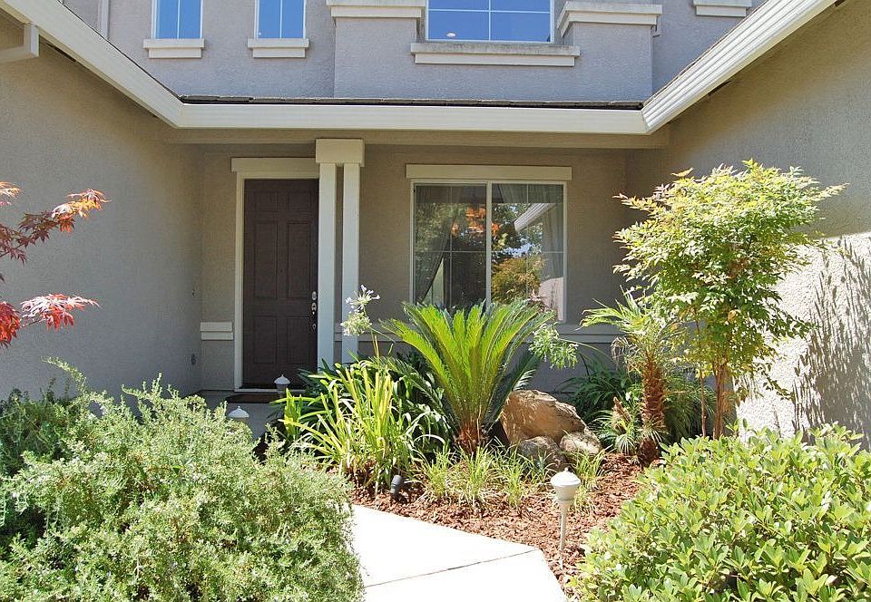 Entrance professionally landscaped