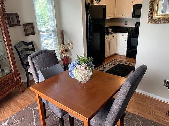 Windows on both sides of dining room make it feel airy and spacious!