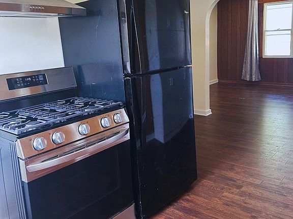A view of the Kitchen, Eat In Area, and Living Room