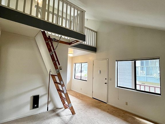 Living Room. Loft ladder folds up when not in use.