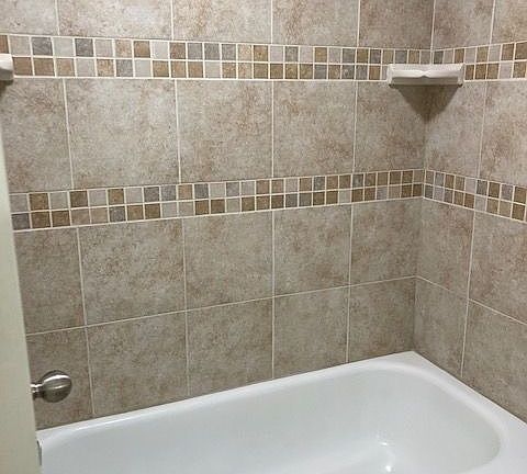 Indulge in the elegance of this chic bathroom, designed with stylish tiled walls. Indulge in the elegance of this chic bathroom, designed with stylish tiled walls.