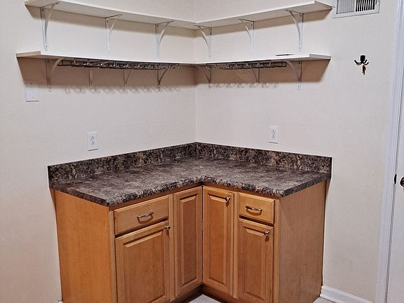 Kitchen corner with wine glass holder shelf