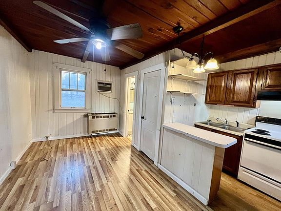 Open living, dining, and kitchen area.