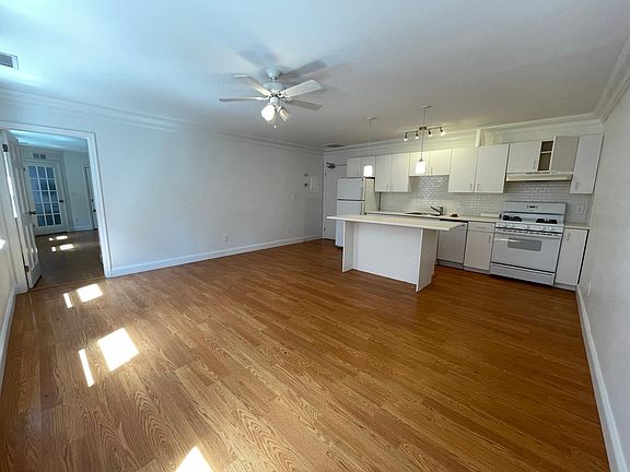 Spacious Kitchen and living area with center island in kitchen