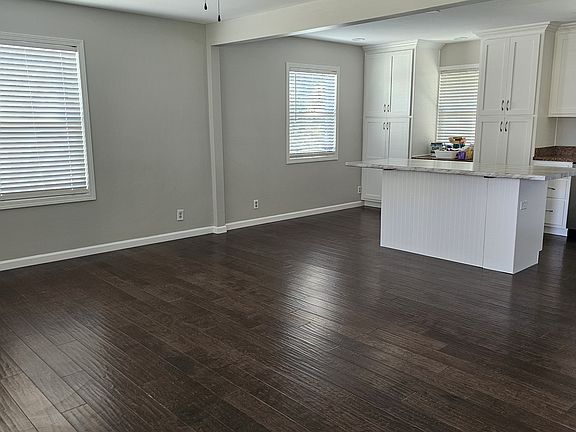 View of living room/kitchen from front door
