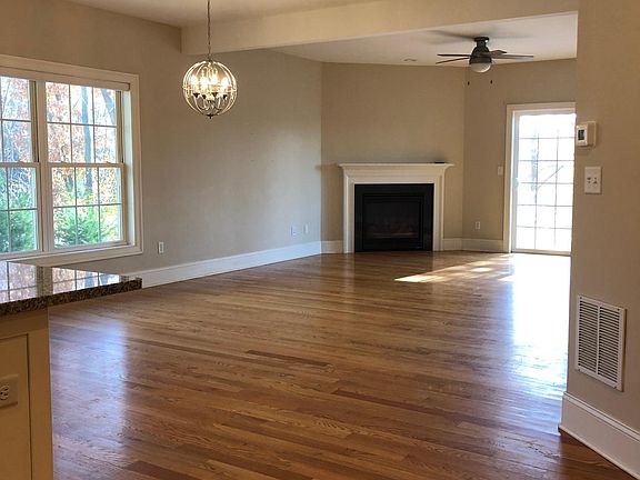 Open concept living space. Kitchen flows into spacious dining room and living room.