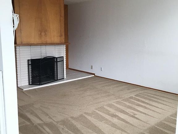 Living room with working fireplace.