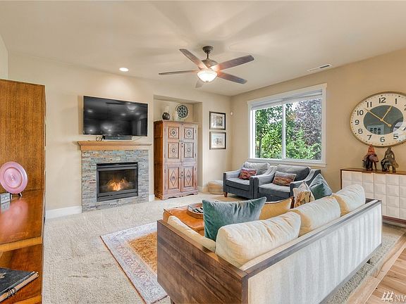 Family Room off kitchen - large windows overlook private yard.