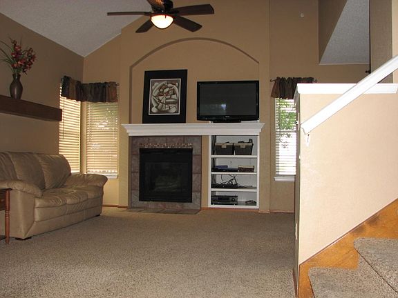 Open concept living room flows to dining room and kitchen