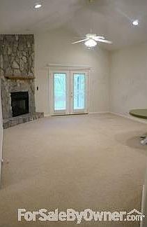 Large Family Room with Fireplace
						:
						French doors lead to screened-porch and backyard
