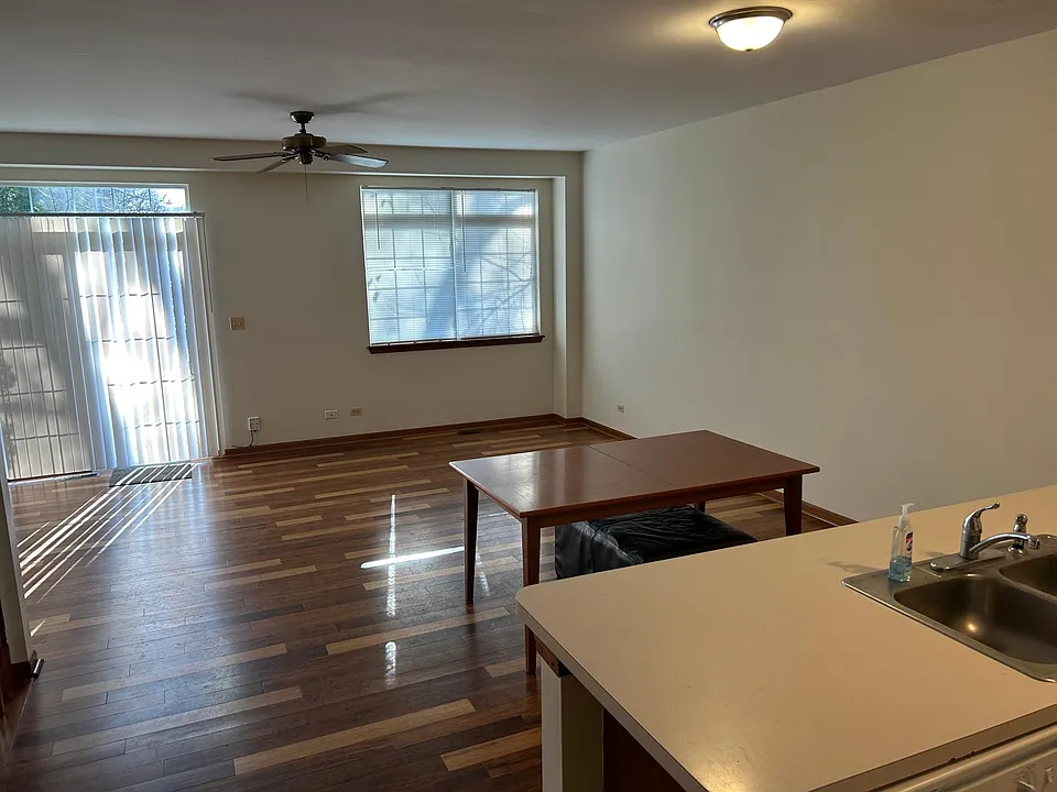 View from kitchen to living room. Notice the sliding glass door that gives access to the backyard.