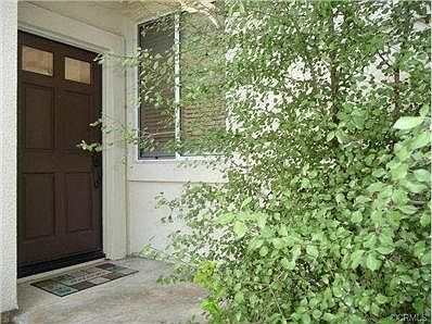 Private side entrance with nice landscaping.
