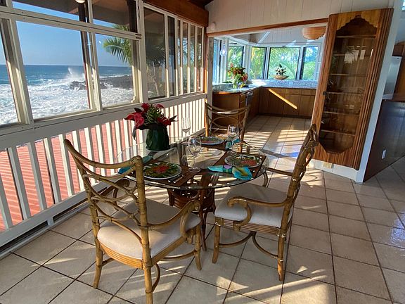 Indoor dining area with windows for views and let_s you hear the sounds of the ocean