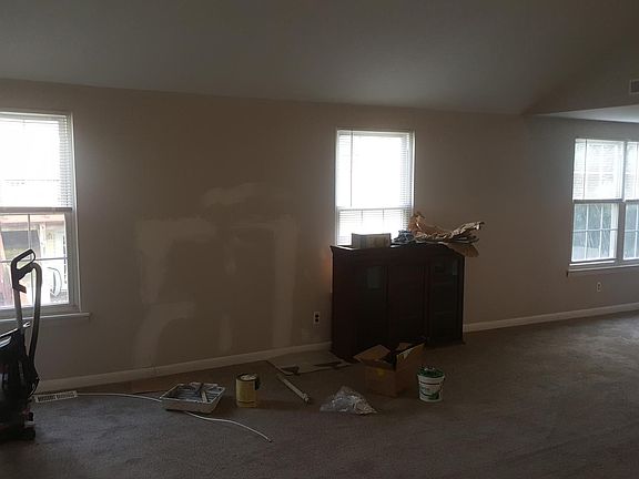 View from the living room, overlooking the back yard. Walls are being repaired and painted.