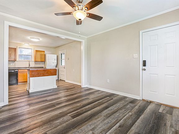 Open living area with in-unit washer & dryer.