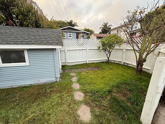 Fenced yard and storage shed