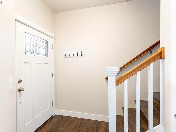 Engineered hardwood flooring in entryway.