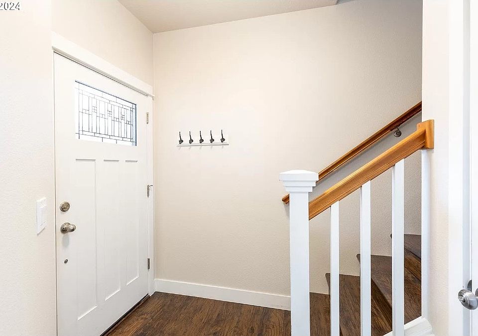 Engineered hardwood flooring in entryway.