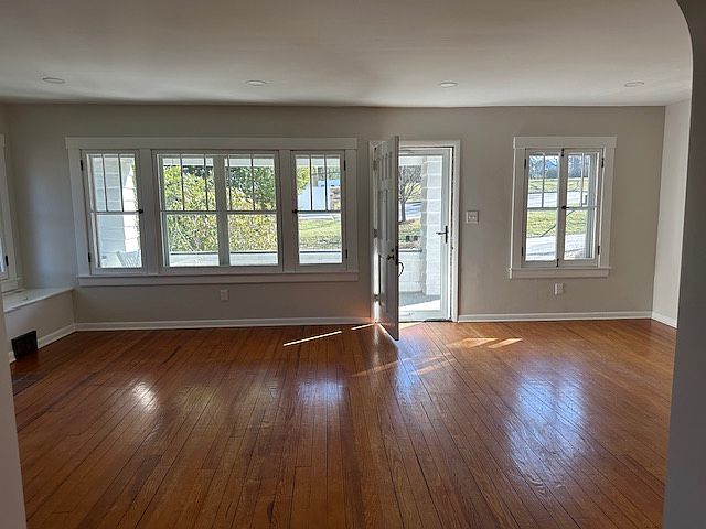 Large living room with wall of windows.