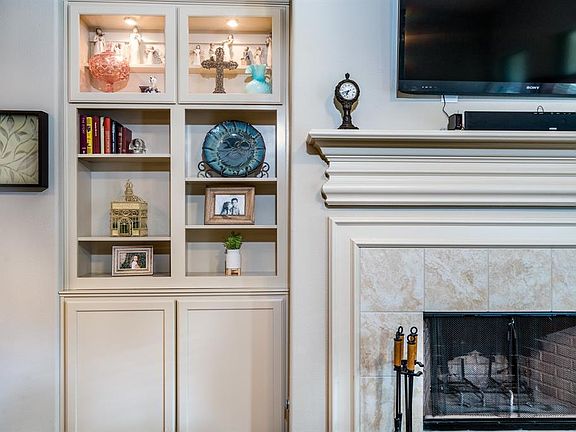 The fireplace is flanked by custom built-ins that can showcase your treasures as well as house board games and what nots!