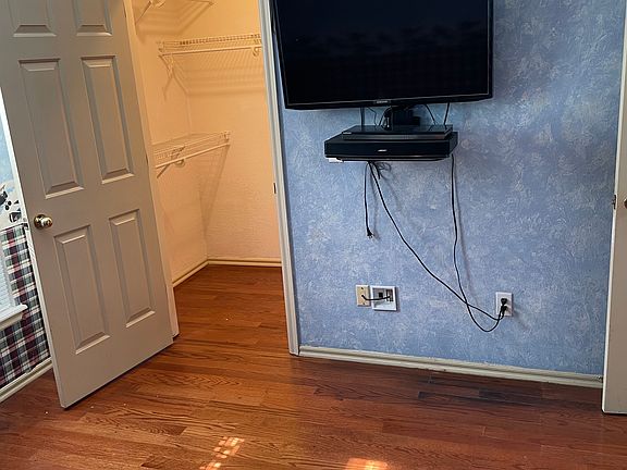 Southwest bedroom, with lighted closet and TV.