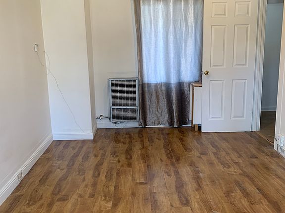 Living room with wood floor covering.