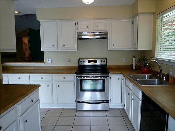 Kitchen with stainless range.