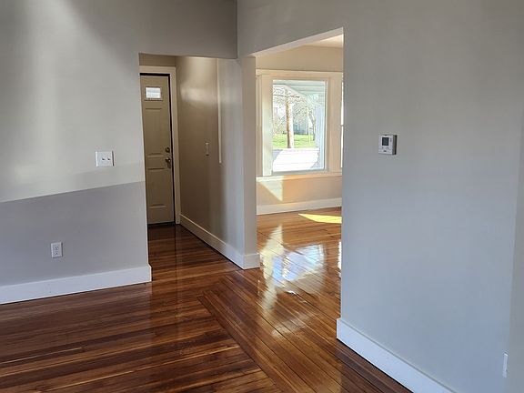 View from kitchen looking into living room, diningroom and the front door.