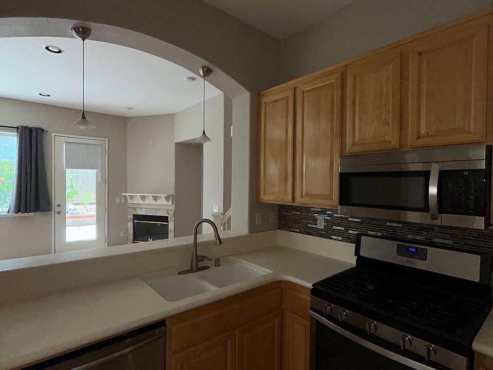 Kitchen area looks out to living room and back yard.