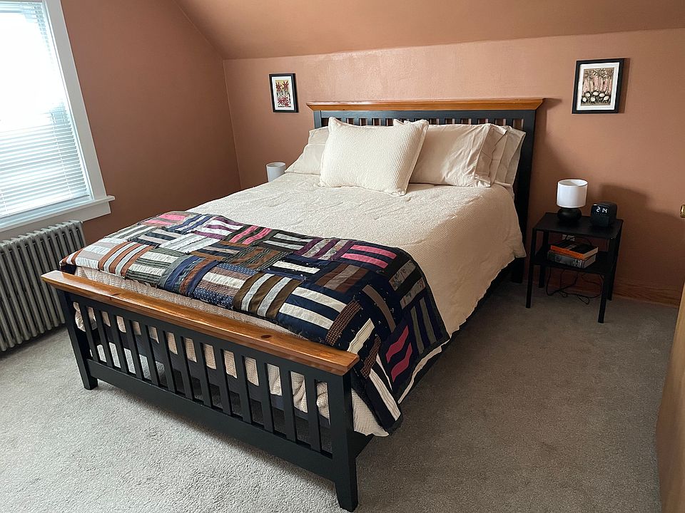 Cozy carpeted bedroom.