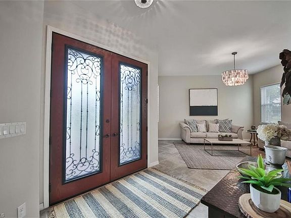 FOYER W/ CUSTOM GLASS DOORS