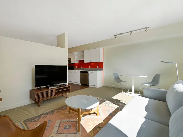 Furnished+ apartment homes come outfitted with a sofa, side chair, side table, coffee table, office chair, desk, TV stand and 50" Television (Representative Image exact items and style of furnishings may vary)