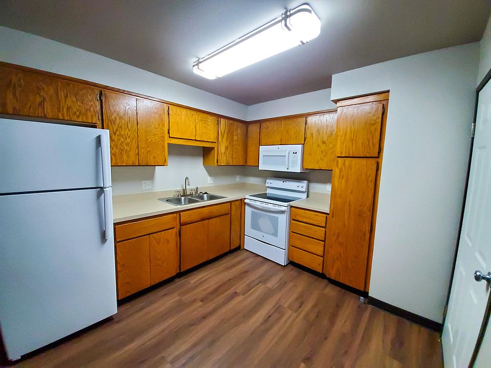 Refurbished kitchen with new counter tops, new appliances, and plenty of storage space.