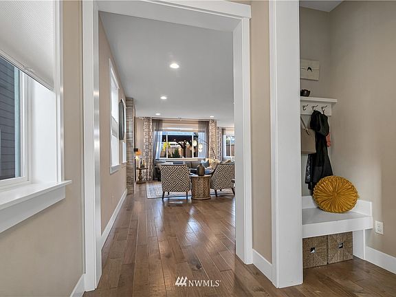 Another view of the mudroom and hallway looking into the gorgeous open concept living room
