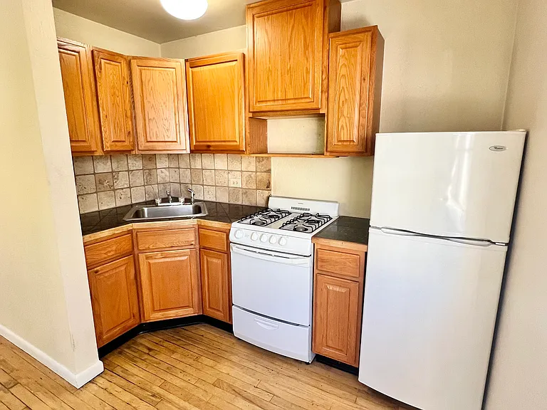 Experience efficient living with this cozy kitchen setup, perfect for culinary adventures. Experience efficient living with this cozy kitchen setup, perfect for culinary adventures.