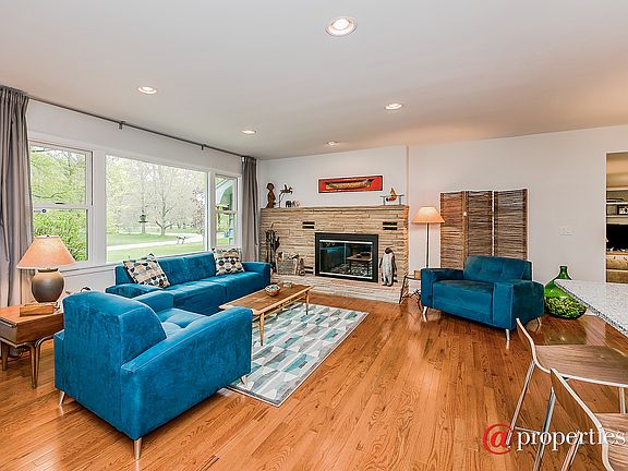 Living room with original wood burning fireplace.
