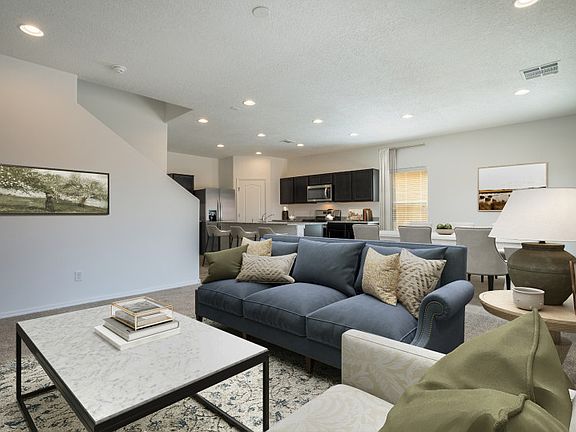 The living room is extremely spacious and is perfect for relaxing after a long day.