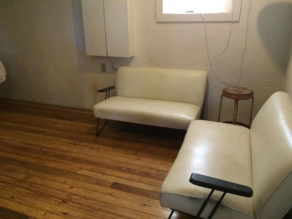 Living/Dining Area with quaint wood floors and mid-century v