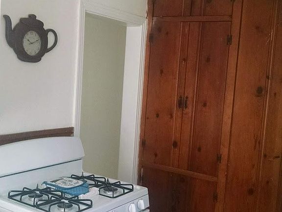 New GE Gas stove and wood pantry.